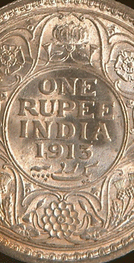 A picture containing object, coin, black, metal

Description automatically generated