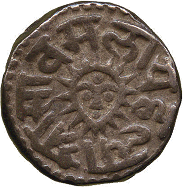 A close-up of a coin

Description automatically generated