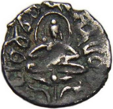 A close-up of a coin

Description automatically generated